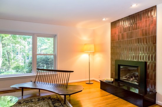 The architect replaced faux black stone around the fireplace with Heath Ceramics Dimension Tile to add a speiclal design element to the space.