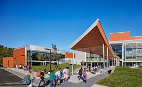 Canopy provides weather protection at the bus drop-off.
A spine of pavers draws students into the three story atrium.