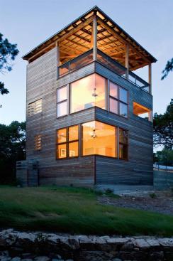 This simple sleeping volume offers great views and warm veneer-lined interiors. The architects clad the building in extremely durable massaranduba tropical wood.