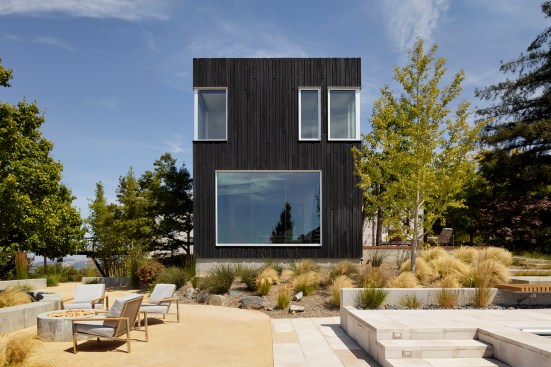 The two-story addition is clad&nbsp;in shou-sugi-ban (burnt&nbsp;Japanese wood).