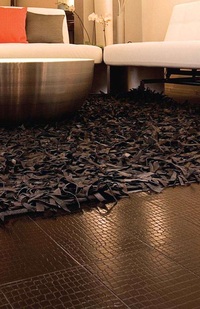 Recycled leather tilesEcoDomowww.ecodomo.com

Uses tanneries' scraps of leather that would otherwise go to landfills



Scraps are shredded and bound using natural rubber and acacia tree bark



Available in eight colors and six textures



Can be used on walls or floors



Exceptional wear and abrasion resistance



Installs like a cork or vinyl floor, but maintains like hardwood