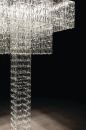 Tile by Fabbian is a building block that allows designers to build chandeliers, room partitions, and focal points. After a specifier determines dimensions and pattern, a custom system is created based on a projects needs. Crystal glass is faceted into a 4"-by-9" clear, blue, or amber tiles that clip into a cable-suspension system. A polished aluminum ceiling channel anchors the cables and also houses the lamping and electrical components. Available with either a halogen 20W MR16 or LEDs with color temperatures ranging from 2,700 K to 6,000 K; RGB LEDs are also available to create static or dynamic colored lighting effects. The modular lighting system was designed by Pamio Design. tile.fabbian.com/en