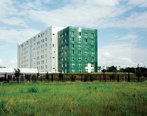 For the design of an eight-story General Services Administration office building just outside of Houston, the architects devised a double-wall system: exterior concrete walls with a curtainwall overlay with fritted glass panels that shield the building from the Texas sun.