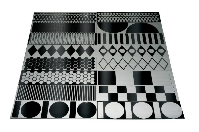 Lasertrons etched stainless steel backsplashes start as a single piece of mirror-finish stainless steel. During the manufacturing process, pattern outlines are masked and the exposed area is brushed with an abrasive. No toxic chemicals are used. Geometric patterns include squares, circles, and diamonds. Panel sizes can be made up to 48" by 96". ¢ lasertrondirect.com