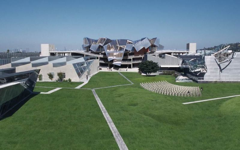A photo montage showing Pterodactyl (center), with Umbrella at right, with greenery replacing parking on grade.
