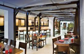 The focal point of Fin's interior is a series of folded metal beams, lit from within by strips of LEDs. Because of a relatively tight budget, many other base building elements were left untouched.