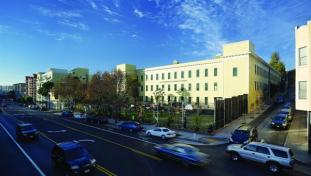 The San Francisco Friends School is located in a largely residential area in the Mission District. The building is fronted by a play yard that is fenced in from the street and has a basketball court, a playground, and bleacher seating for outdoor assemblies.