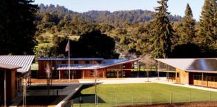 Three buildings?a town hall, a community hall, and a library?make up the new Portola Valley Town Center, a sustainable civic center for a small town south of San Francisco. Green measures include solar panels on the south-facing roof slopes of two of the buildings and a maintenance shed. Together they form a 76-kilowatt array that will help ease the energy load of the complex.