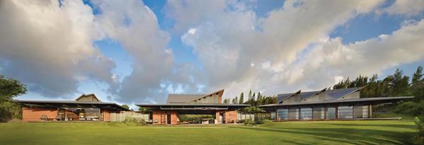 Traditional Hawaiian buildings inspired the home's corrugated metal roofs, which are tailored to the site's wind patterns.