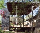 The domed pizza oven didnt match the straight lines of the house, so Dan Shipley added a brick surround. He painted it black to make it recede into the background of the site. These types of outbuildings are almost pure form, he says. Theyre always a