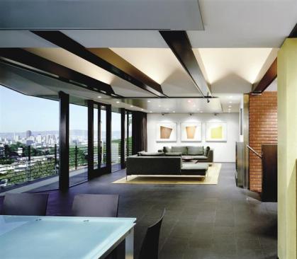 Sophisticated materials and colors, and a radically simplified look, make this 1950s house finally worthy of its extraordinary view.