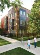 The buildings' colored bays animate the street.