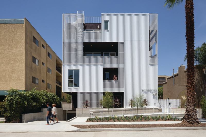 749 Cloverdale's layered facade conceals balconies that serve as exterior circulation for the complex.