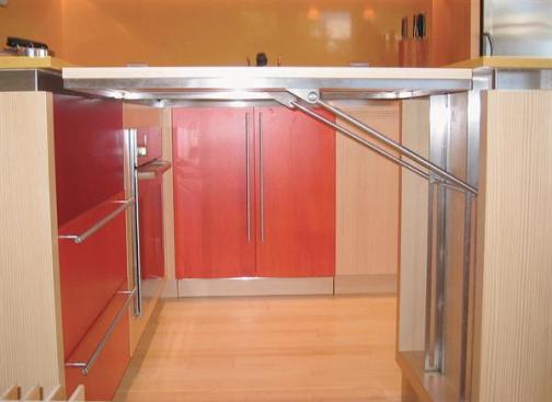 Floors and raised counter are bamboo, and the cabinetry is made of verticalgrain white fir veneer from a certified source and a low-formaldehyde MDF substrate. 