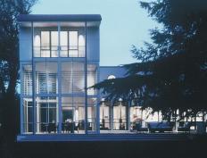 The glittering three-story steel framed tower is capped by a guest suite offering views of the Rappahannock River.
