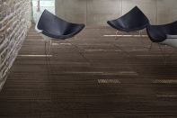 Inspired by the natural simplicity of un-dyed wool and linen, Duo and Trio from Interface can be laid out in several patterns, including herringbone and linear designs. When installed in an ashlar coursing, the 25cm-by-1m plank tiles take on a seamless, broadloom-like look. Duo and Trio are made entirely from non-virgin yarn that is combined with reclaimed carpet fiber and salvaged fishing nets. interface.com
