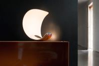 Curl from Luceplan doesn’t play it straight. The die-cast aluminum luminaire by London-based Sebastian Bergne has no designated base, allowing it to stand in a variety of positions, including on its side. With a proprietary LED module that changes the color temperature of its ambient white light from 2400K to 3500K, the fixture measures 10" tall by 8" wide and 9" deep, when oriented upright like a crescent moon. luceplan.com