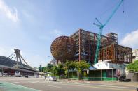Construction on the Taipei Performing Arts Center in Taiwan, designed by OMA, tops out Wednesday.