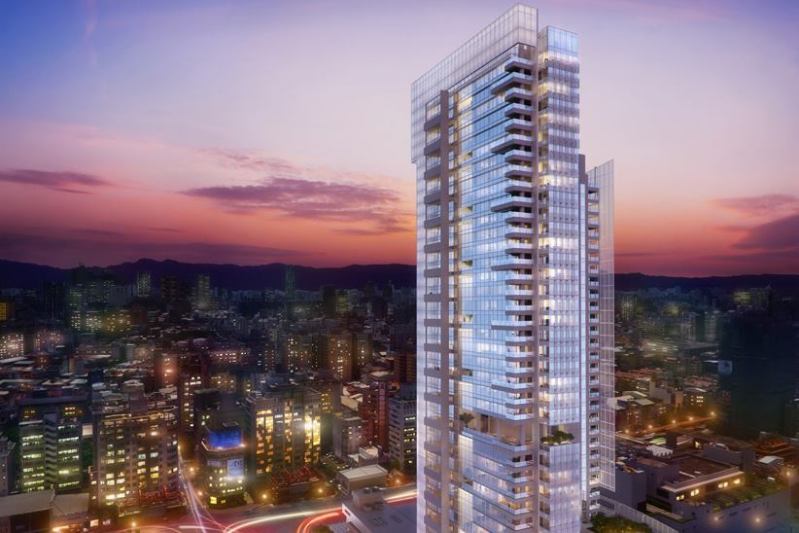 Taichung Condominium Tower stands among a blend of low- and high-rise buildings in the urban city.