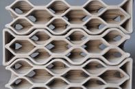 DesignLabWorkshop developed each brick geometry by first scripting a wall and then subdividing that wall in Grasshopper into modules, which became the bricks. When the wall profile changes, the shape of the individual bricks automatically updates.