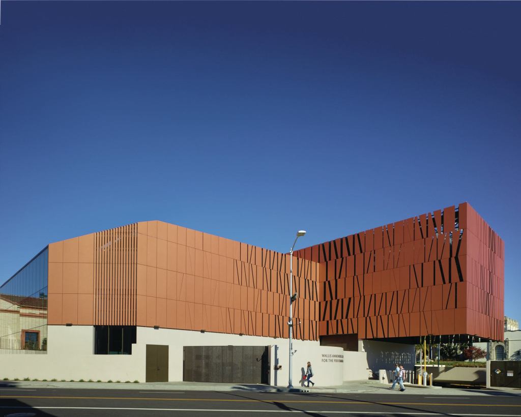 The addition cantilevers over the entrance to a 450-car parking garage shared by the Wallis and City Hall (beyond).