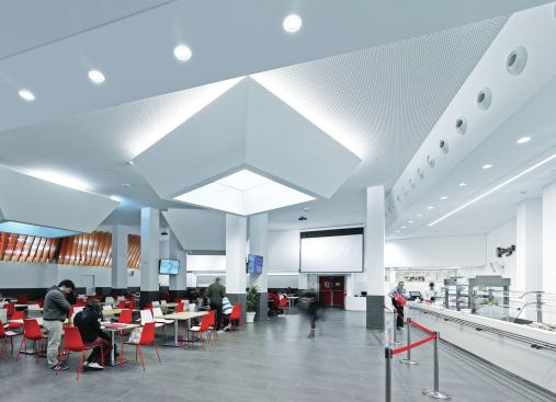 The illuminated light-wells in the cafeteria are set to 2700K in the morning to create a more relaxing environment and quality of light for students.