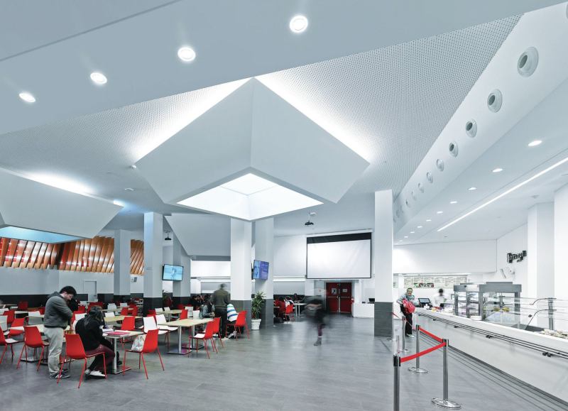 The illuminated light-wells in the cafeteria are set to 2700K in the morning to create a more relaxing environment and quality of light for students.