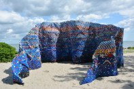 Artist Arunkumar H G created the&nbsp;installation "Droppings and the Dam(n)" out of more than 70,000 bottle caps collected over a year to comment on how disposable and wasteful lifestyles create unhealthy environments. Sited in Aarhus, Denmark, the artwork is part of the "Sculpture by the Sea" exhibition.