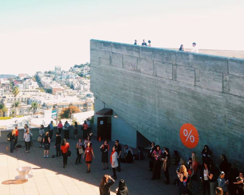 Attendees gathered outside a symposium break.
