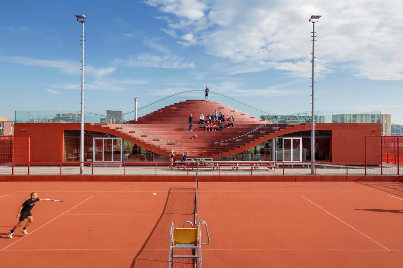 The southern fa&ccedil;ade, which features seating that overlooks the clay tennis courts.