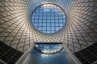 Sky Reflector-Net, a 79-foot-tall sculpture, harnesses natral light and brings it deep into the Fulton Center in Lower Manhattan.