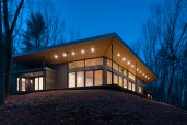 The angled roof enhances the glow of the lantern and creates a unified gathering space for the clients and their guests