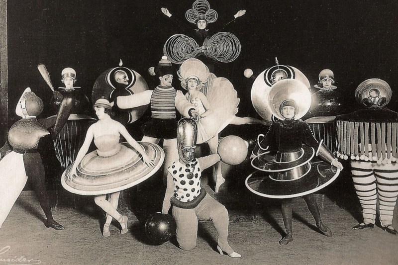 A group of performers from a Triadisches ballet by Oskar Schlemmer, produced during his time with the Bauhaus (1927)