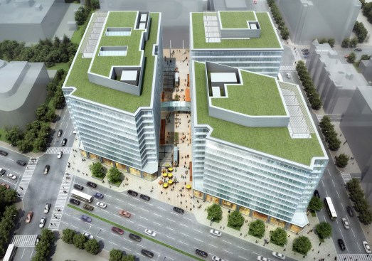Aerial View from the North showing three towers and green roof terraces.