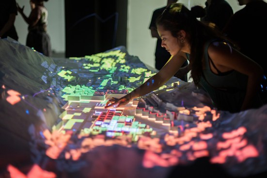 CityScope Andorra is a 3-D augmented-reality platform that visualizes complex urban data on a small-scale model of the country. Users can interactively test scenarios on the model, such as how many parks to include in a city, adjust heights of buildings, calculate the optimal mix of residential and commercial real estate, and whether to allow private vehicles or only car-share services. The impacts of these changes on traffic, walkable access to amenities, and other metrics are then updated in real time.