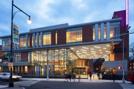 The transparent façade of the new Center for the Performing Arts welcomes engagement with the community, unlike its forbidding predecessor.