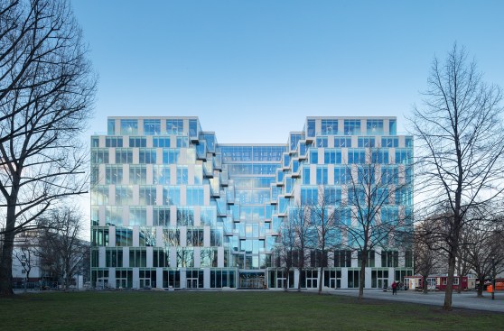 Sitting directly on Hermann-Stöhr-Platz, UP! adds two floors plus a roof pavilion and rooftop terrace with underground parking for 100 cars