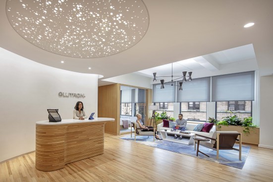 The entryway features an overhead lighting sculpture that can be activated to create a dynamic biophilic pattern on the floor below.