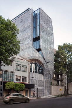 A cutaway in the skin creates an arch for a second-story terrace at Profiles' southeast corner.