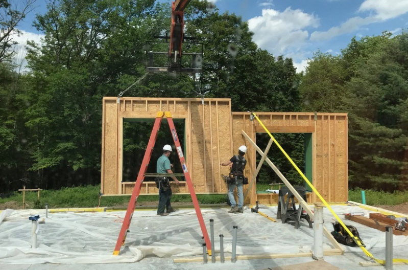 Threshold Builders' panels are set on the jobsite.