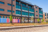 East side of building showcasing artist murals