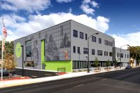 The local community is forefront in the façade of Moving Everest Charter School, where real students are featured in the screen-printed images beneath perforated corrugated metal panels.