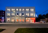 The bold red of the recessed entrance continues along an inside wall to help orient patrons who are partially-sighted.