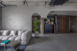 terrazzo floors and walnut furniture create a tranquil and warm atmosphere