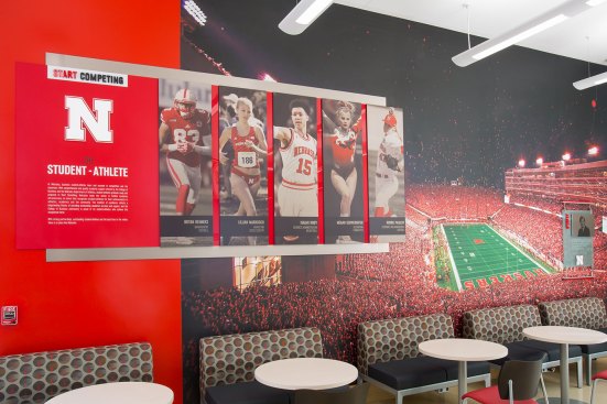 Start Competing 
The College of Business is also a key recruiting tool for Nebraska’s athletic program. This display shows five athletes – each in different sports – who are exemplary business students in addition to standout athletes. 
