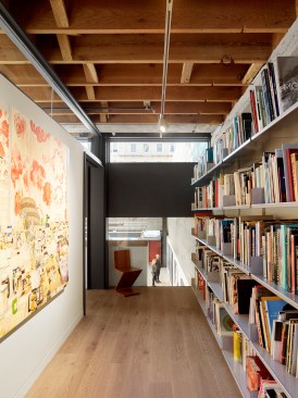 Second floor library allows viewing to main gallery below.