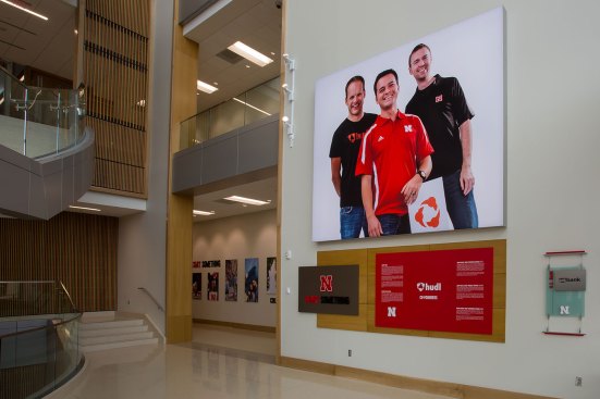 Start Something
Greeting visitors upon entry in the Henrickson Grand Atrium is a 14-foot tall display featuring the founders of HUDL, a leading software company aiding football coaches in evaluation and preparation. These three recent graduates of the University of Nebraska show the entrepreneurial tradition of the program using the example of alumni who followed their passions to start a cutting-edge business. 
