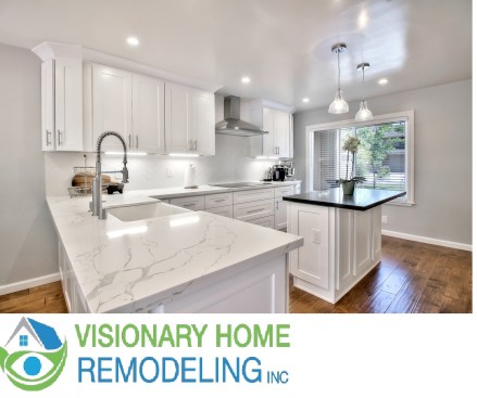 White shaker cabinet, Open space kitchen with quartz counter top. 
Wood flooring 