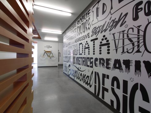 Circulation spaces echo Adobe's commitment to innovation through graphics and product displays.