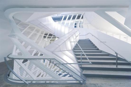 A 20-foot-wide grand stair rises four stories through the skylit atrium.
